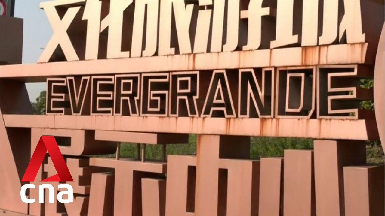 China's Evergrande avoids default after paying overdue interest