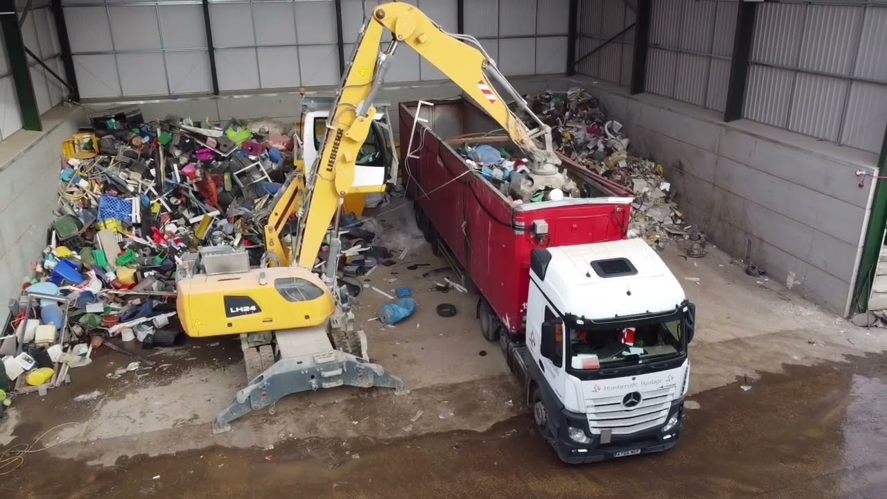 Loading mixed rigid plastic waste for re-processing at Van Werven - Selby