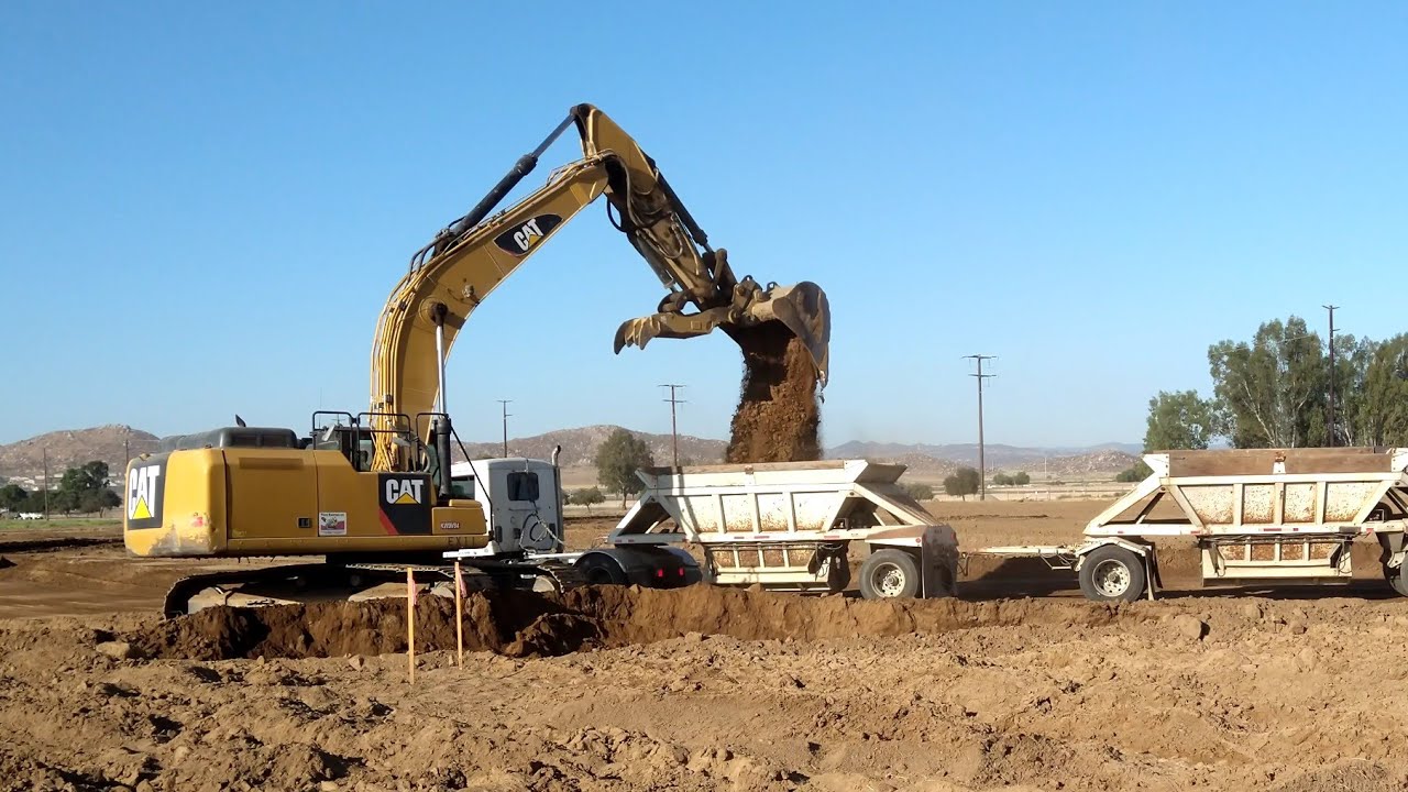 CAT 336 Excavator loading Belly Dump Trucks - full buckets!!
