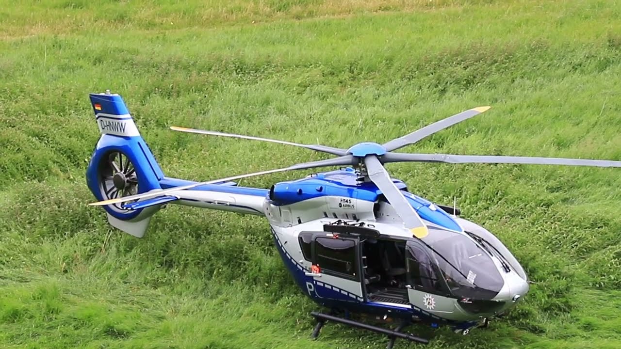 Police helicopter D-HNWW static and departure. View from above.
