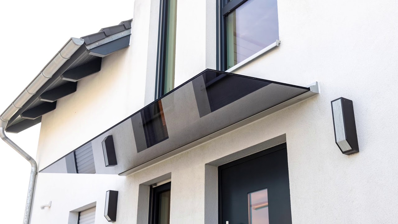 Glasbau - Montage eines Ganzglas-Vordach - Schwarze Glas Technik Braunschweig