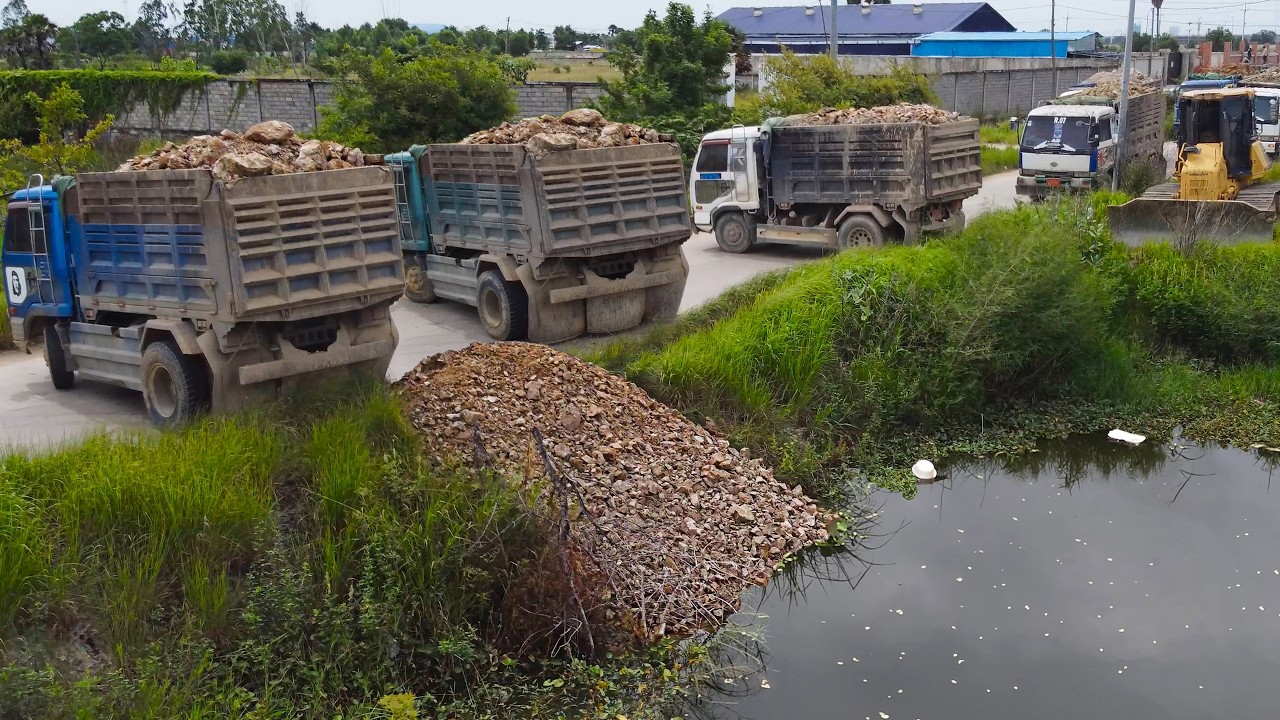 Great Project!! Talented Operators fill Soil Rocks delete Pond using Trucks 5ton with Skills dozer