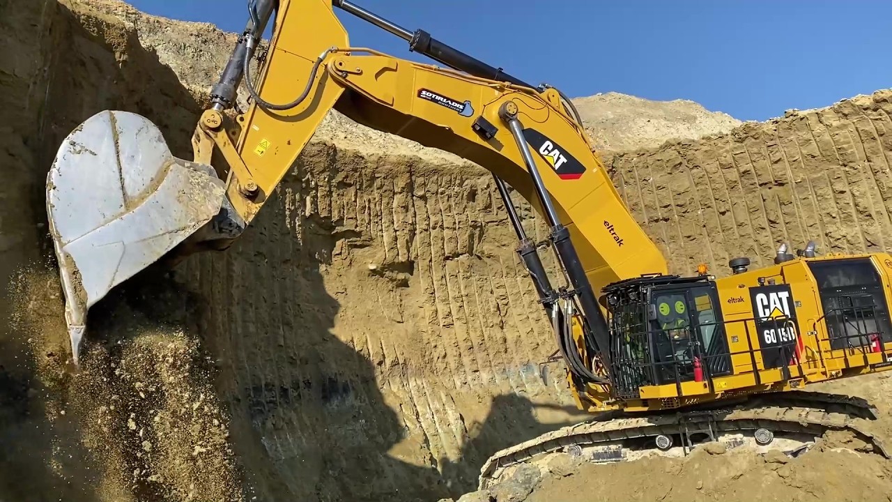 Cat 6015B Excavator in Action: Massive Overburden Loading on a Double Bench - Sotiriadis Mining