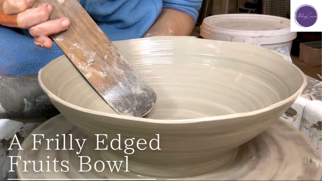 Throwing a Frilly Edged Large Fruits Bowl on a pottery wheel.