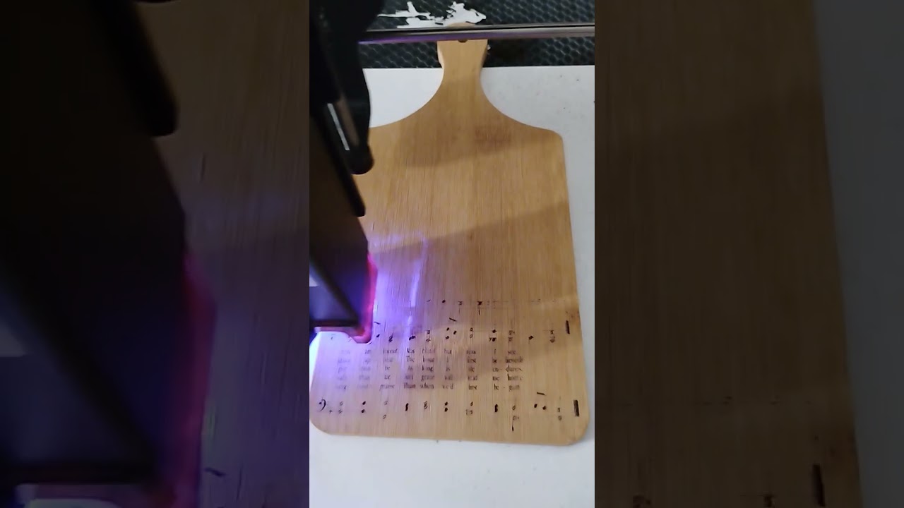 laser engraving amazing grace on charcuterie board. 
