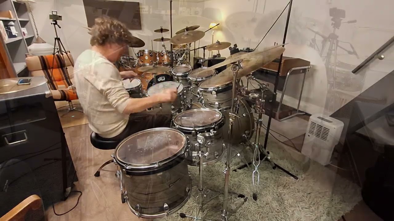 Drumming along the funky accents in the Acid Jazz track 'Return of the space cowboy' by Jamiroquai