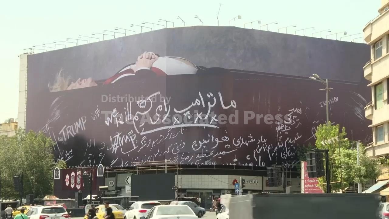 Large billboard depicting Trump lying in a coffin installed in central Tehran