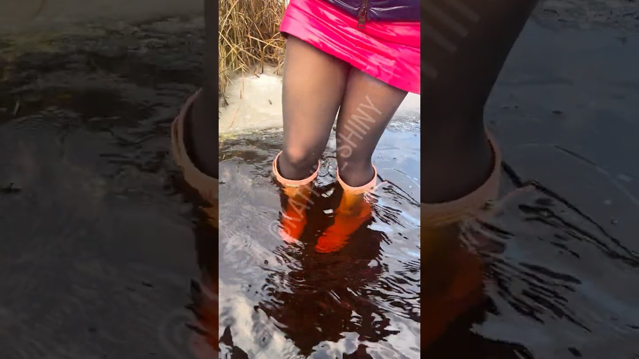 Gorgeous beautiful Lady in waterproof shiny nylon hard stuck wet snow messy flooded Hunter wellies