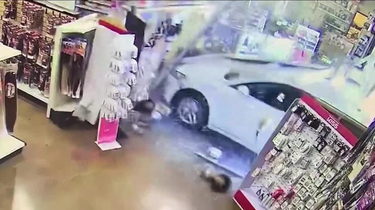 Shoppers hurt when car crashes into beauty store