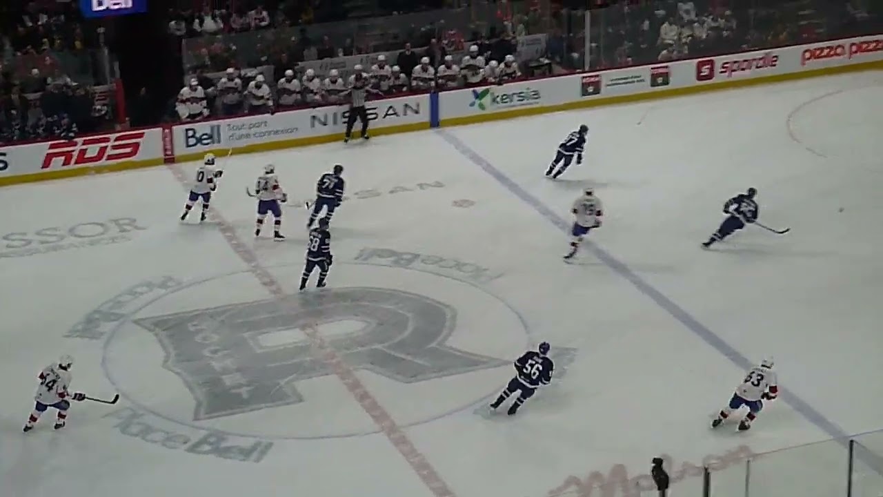 Laval Rocket's Florian Xhekaj lays a huge hit on Toronto Marlies' Rhett Parsons 12/12/25
