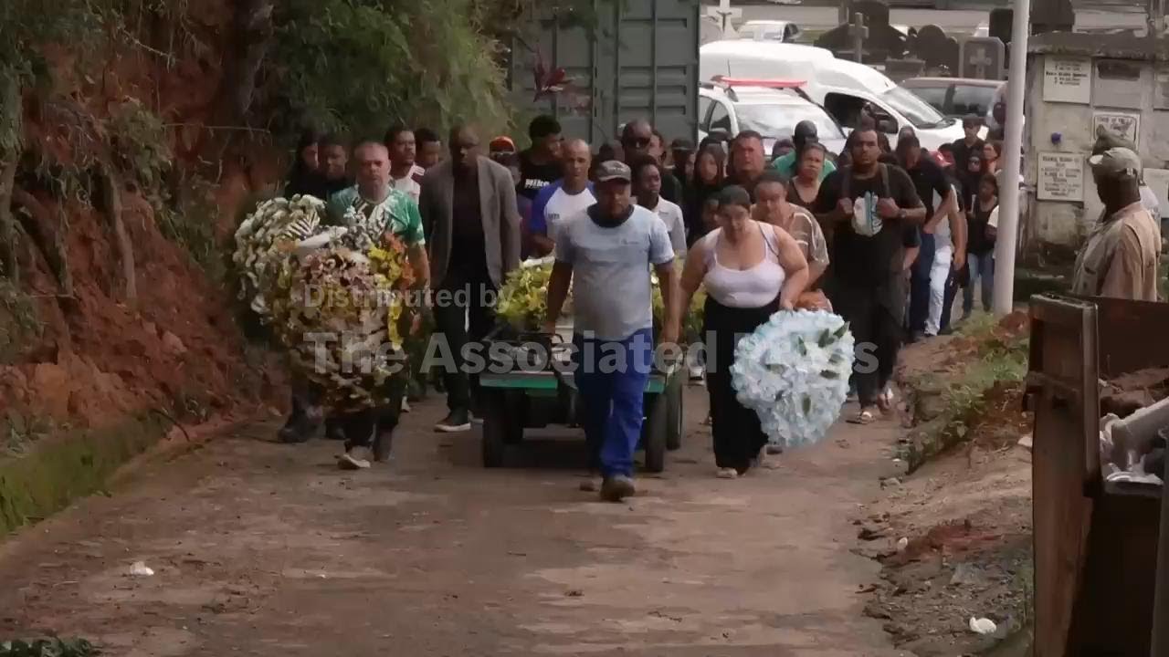 Families of flood victims in southeastern Brazil begin burying their dead