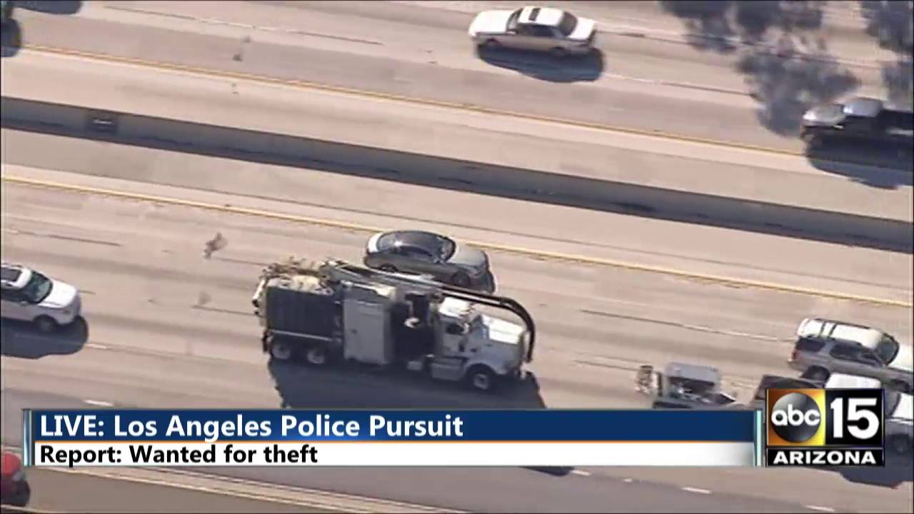 Los Angeles police chase as a person wanted for theft stops for gas