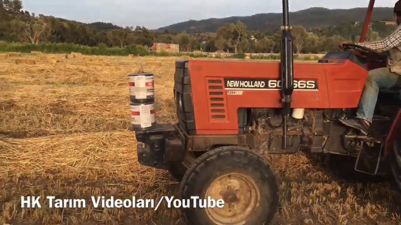 Newholland 60-66s Kara kafa balya basıyor.
