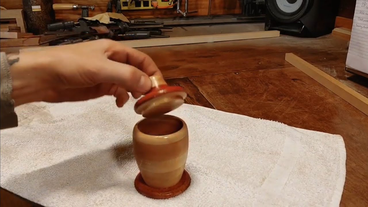Woodturning a small honey jar shaped container.