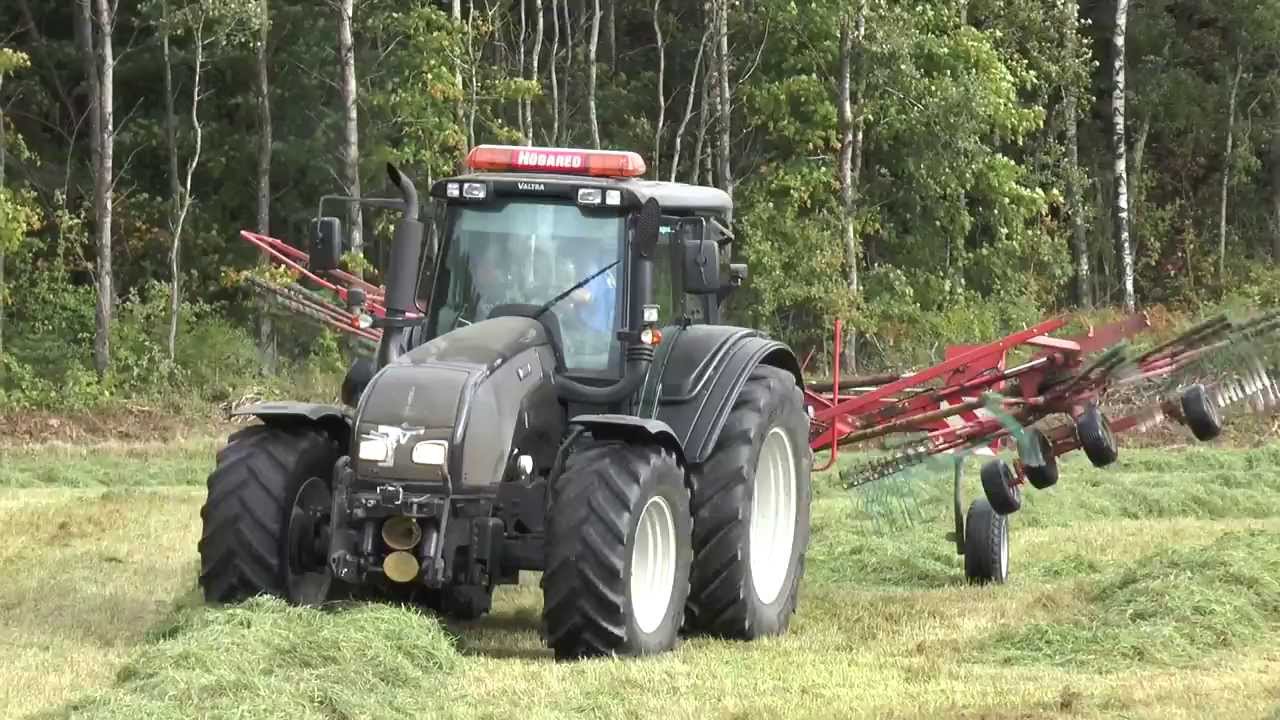 Silage 2013 Valtra with a tedder Terralink Quattro outside Ullared 2013