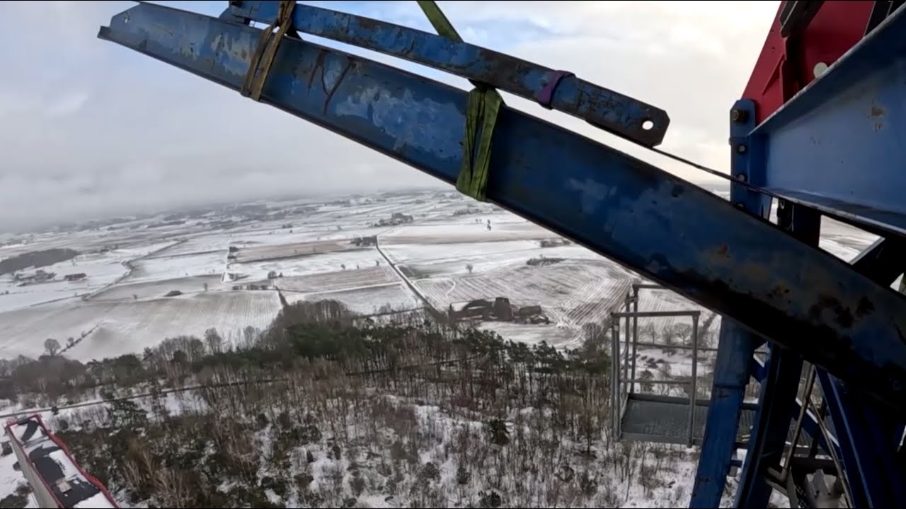 (Climbing down of COMANSA 21LC550, with hydraulic cage. (85m) Демонтаж COMANSA, на монтажной стойке.