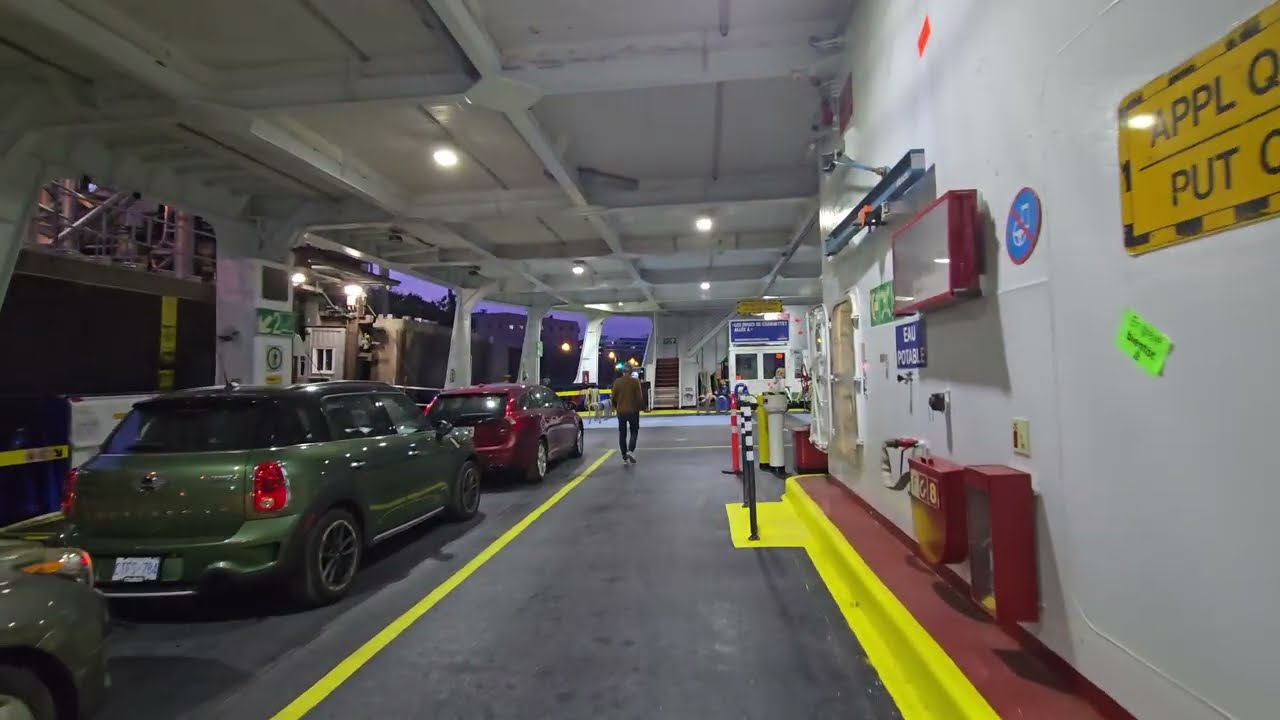 Crossing St Lawrence river by ferry with a car, Traverse Quebec - Levis