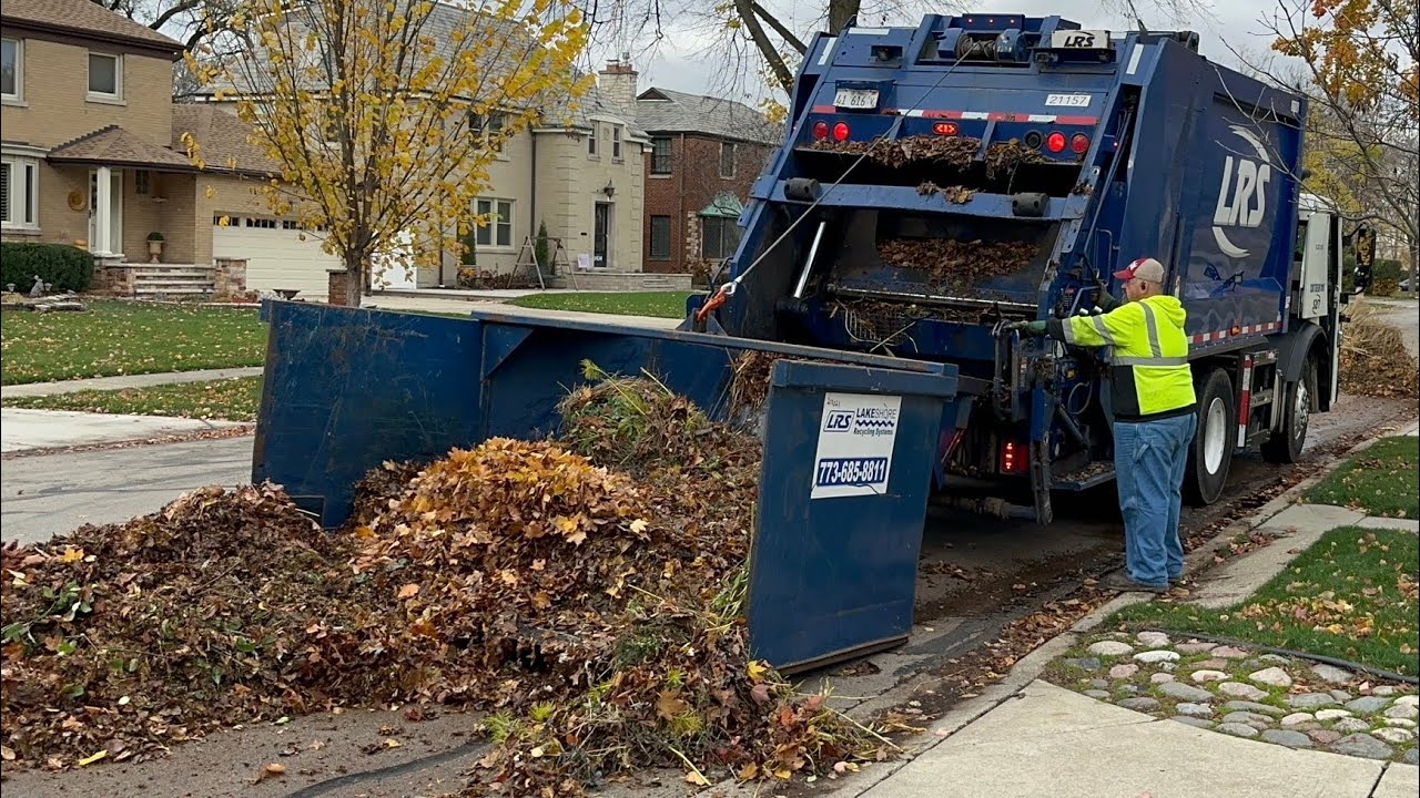 LRS Heil Rear Loader Garbage Truck Packing Massive Leaf Piles with a Special Attachment