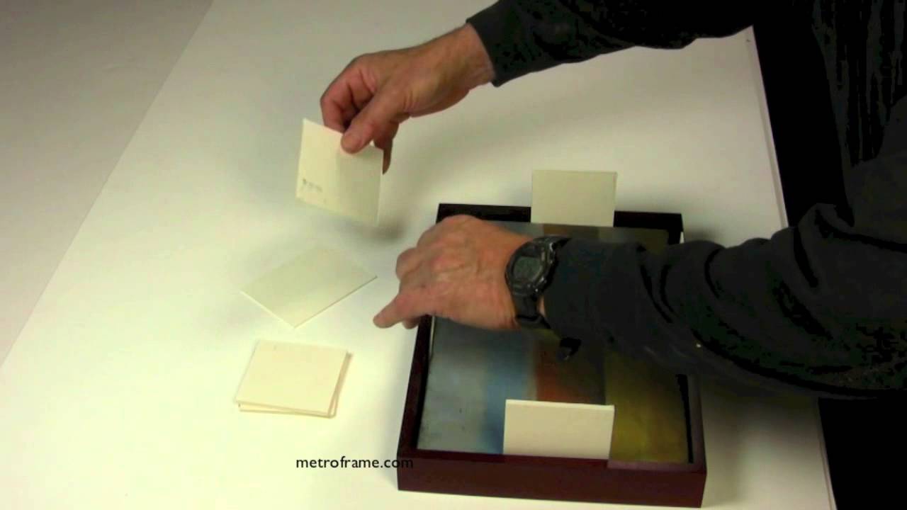 How to attach paintings to wood floater frames