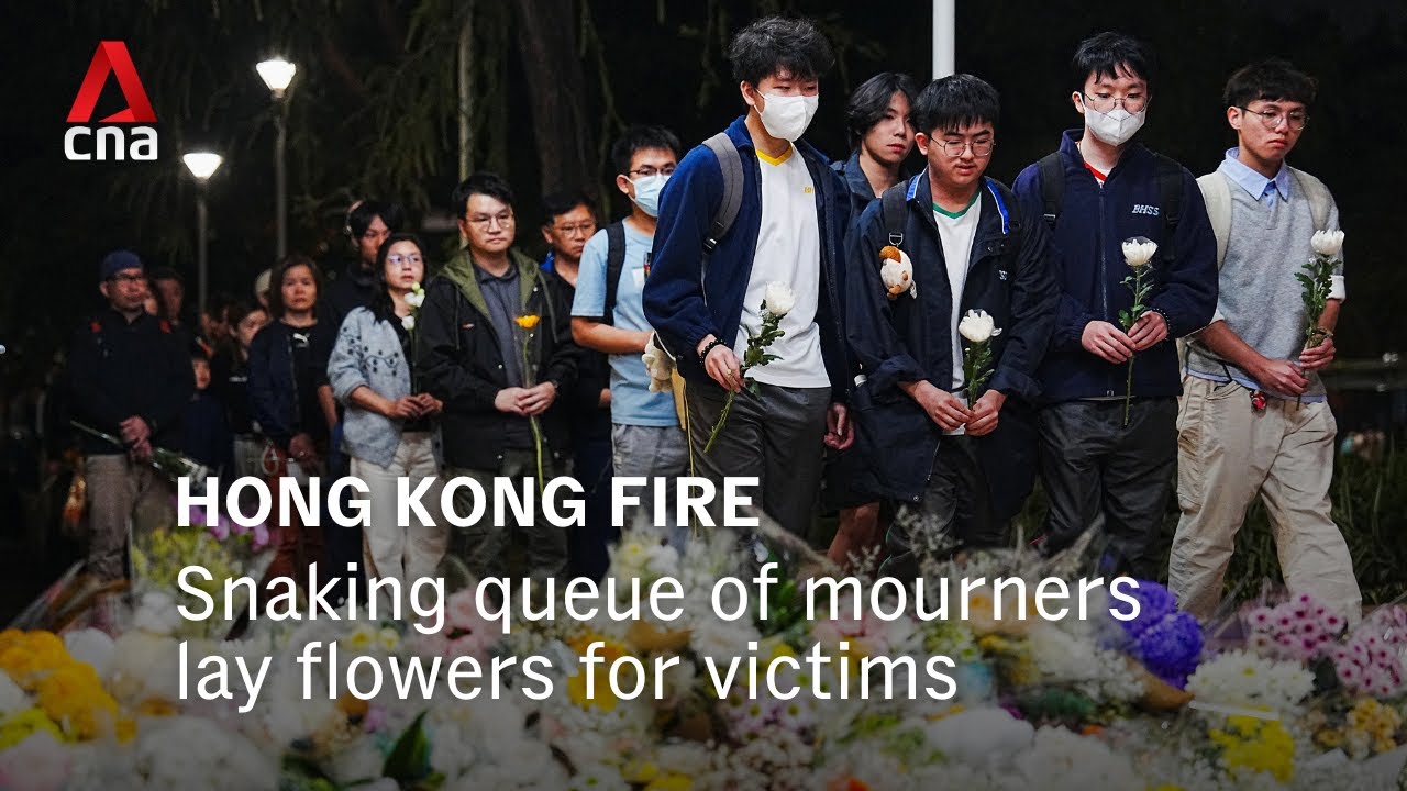 Mourners in Hong Kong queue more than 1km to lay flowers for victims