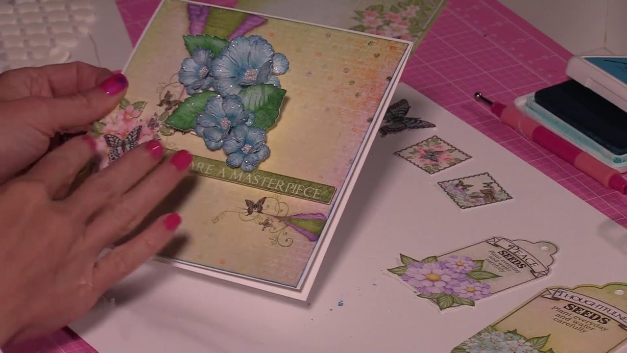 Discover how to layer and add flowers + elements to your cards