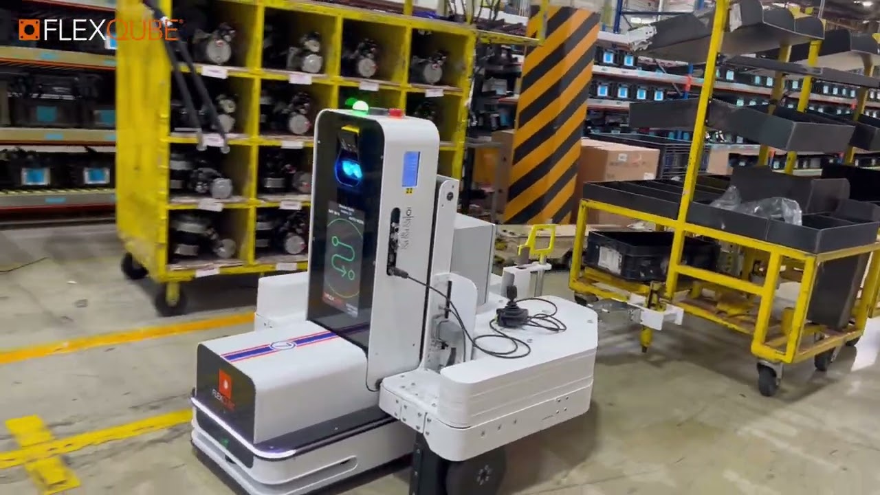 AMR  Transports Towing Carts in Automotive Facility | FlexQube