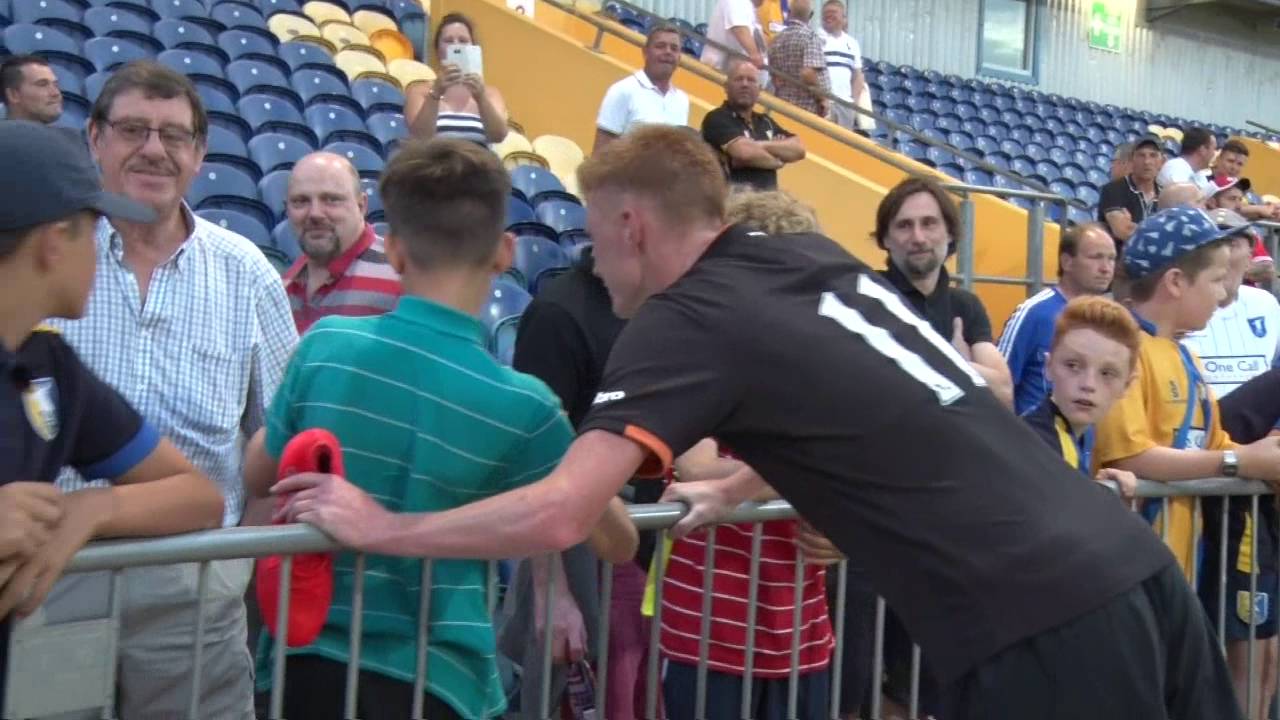 Hull midfielder Sam Clucas takes time to have pictures with young Stags' fans