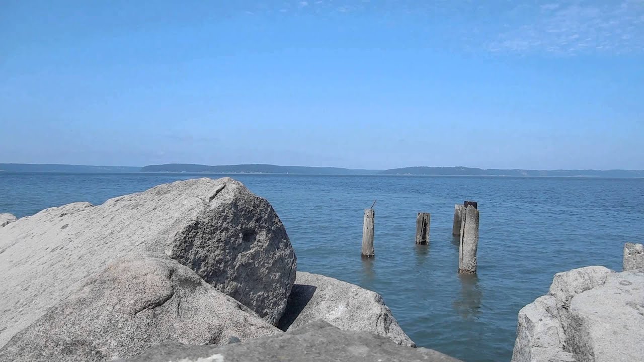 Rocks, old pilings & gentle waves - Free Stock Footage