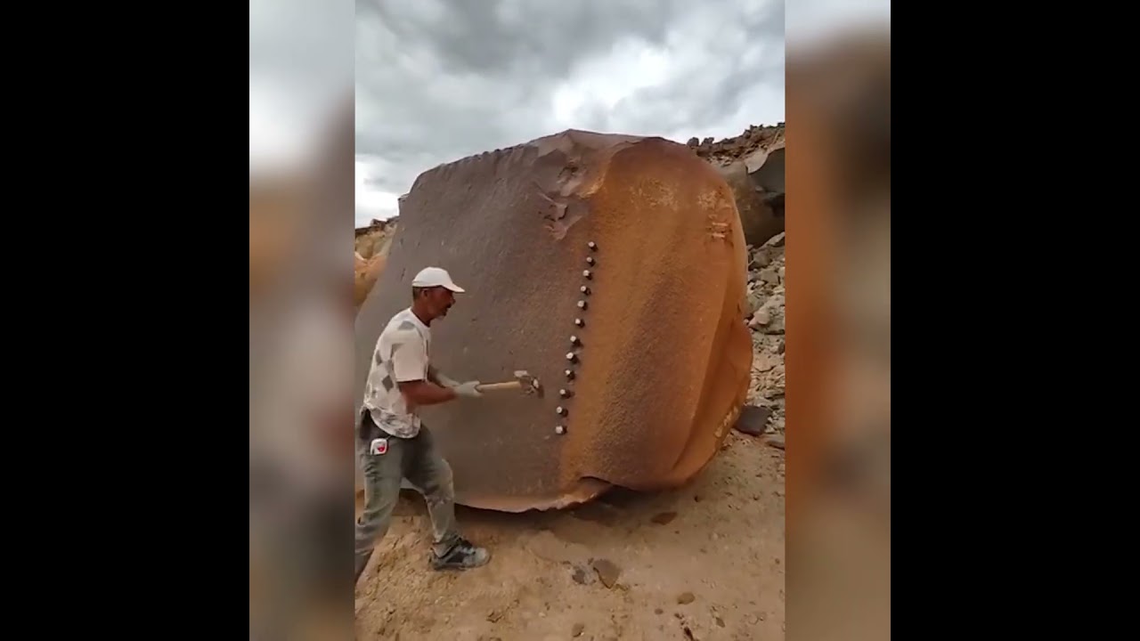 Man breaking a massive rock with nails #amazing #work