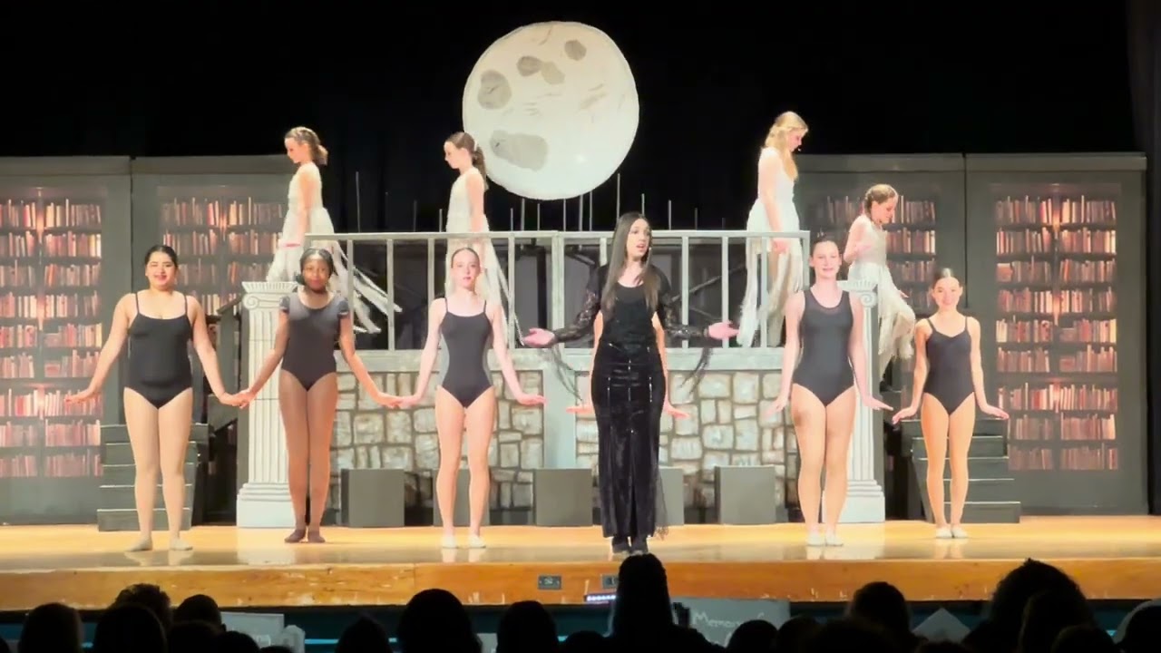 Kelly as Morticia Addams sings “Death is Just Around the Corner”