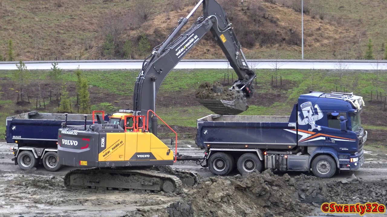 4K| Volvo EC250E Loading Two Scania Trucks