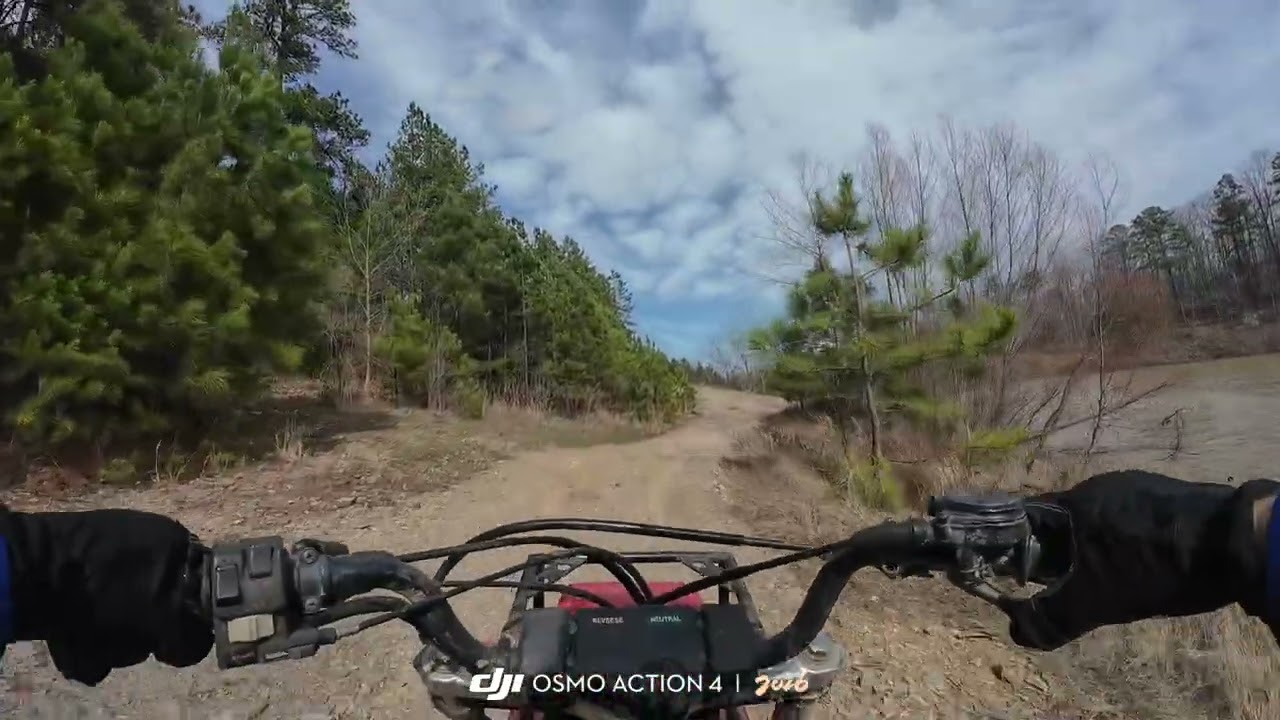 Honda 250sx trail riding out by the lake at Carter's after February 2026 rain