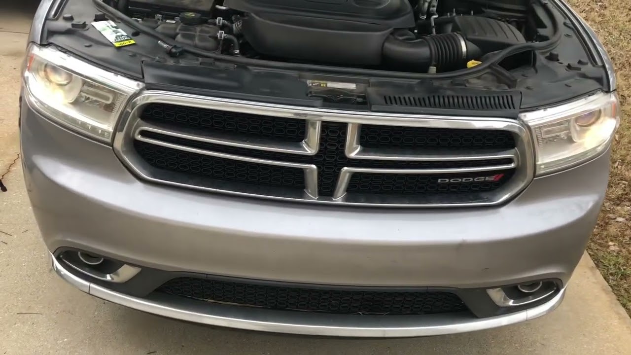 How to replace 2014-2018 Dodge Durango head lights. No tools needed.