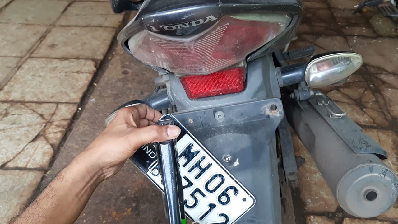 Number plate fitting permanently using Blind rivets