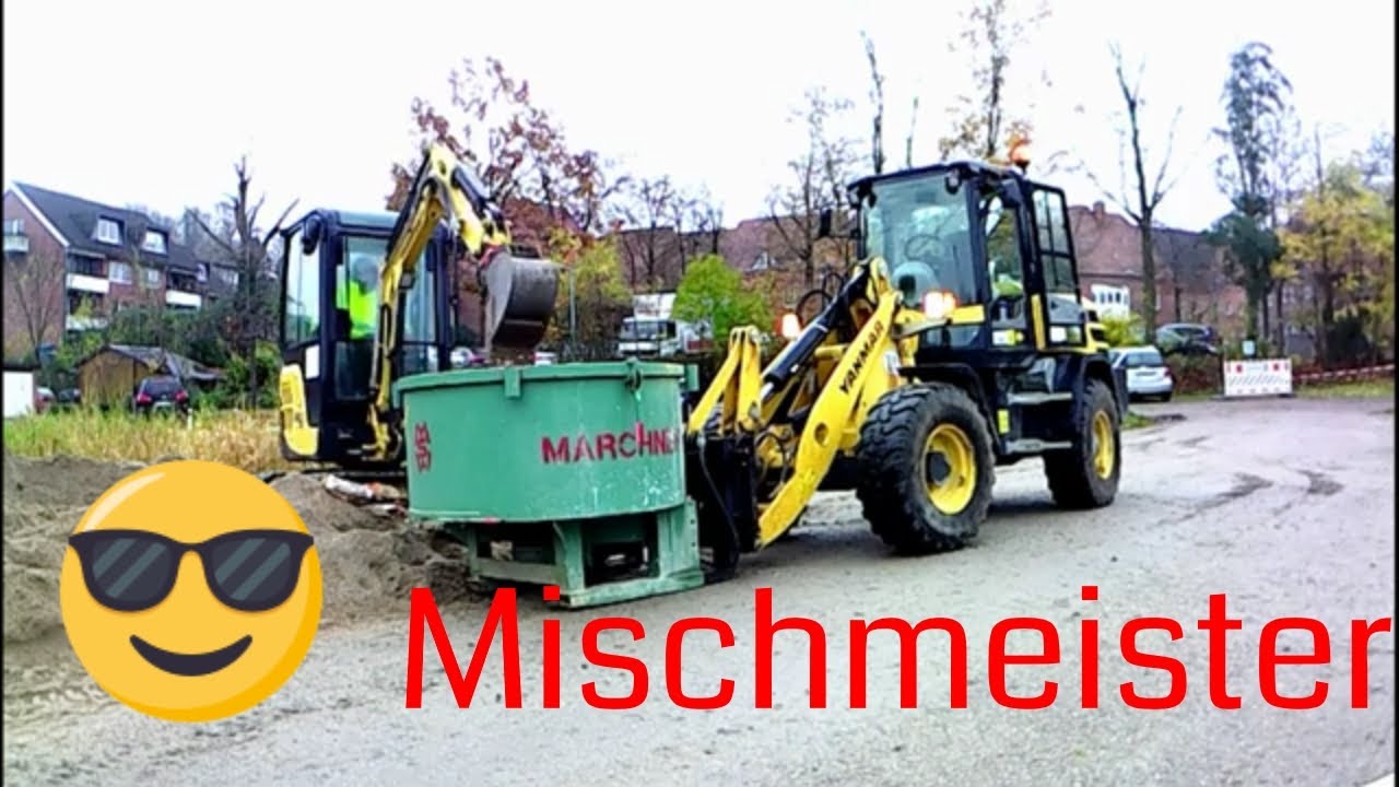 Bagger fahren-Yanmar V120 mit Marchner Betonmischer beim mischen von Beton,befüllt mit Yanmar SV16