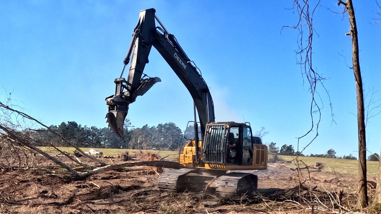 Clearing trees off the last section of the 1950 pond.