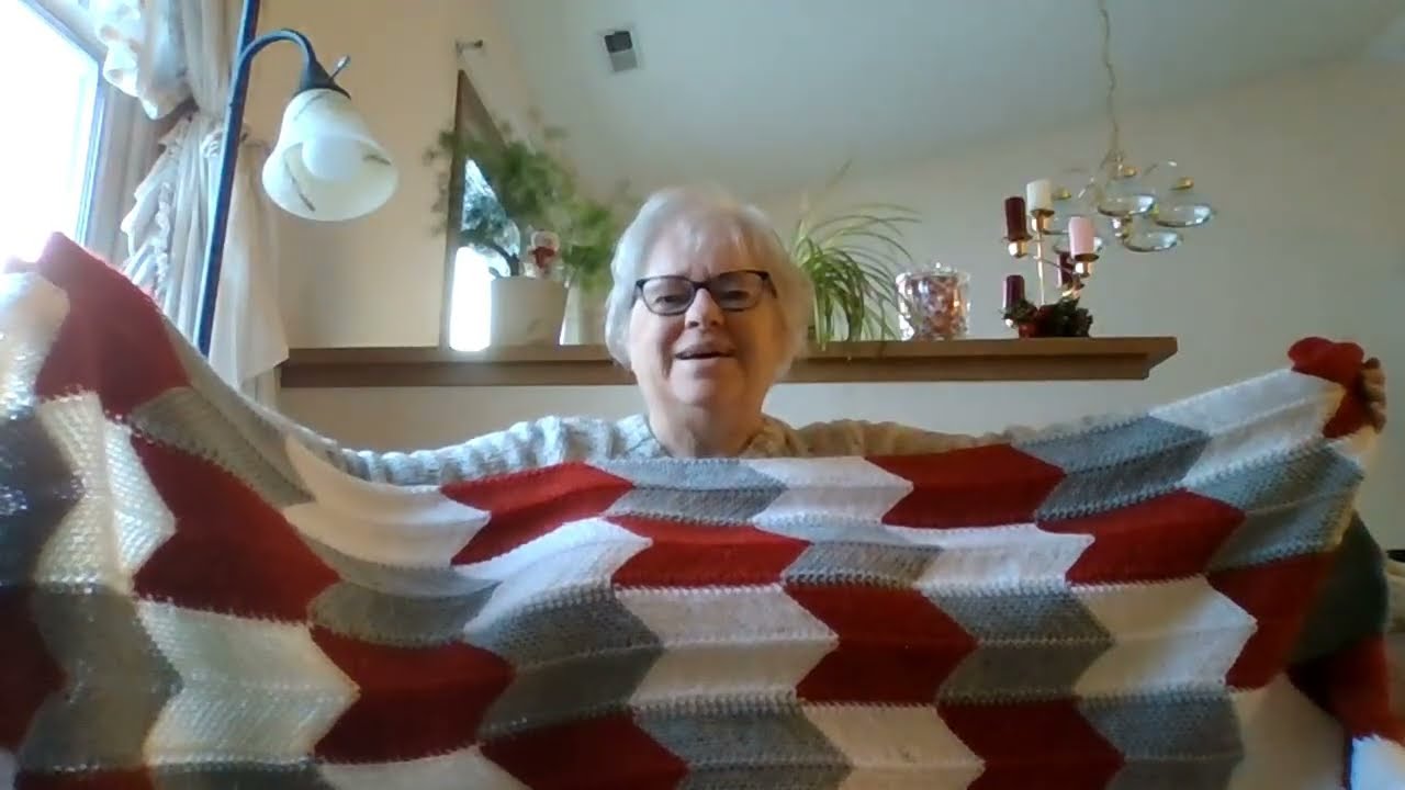 Finishing knitted afghan and chatting a while.
