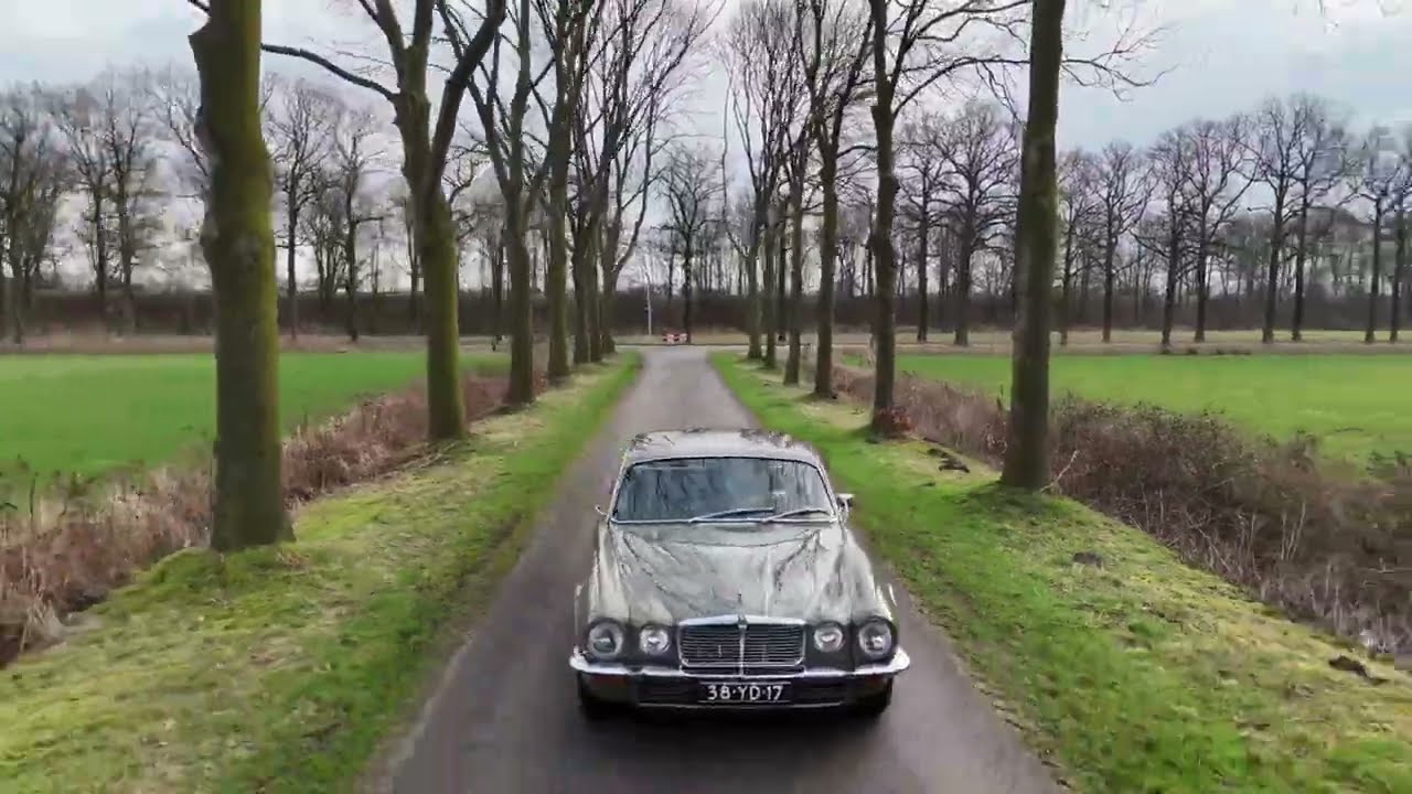 Driving a real icon, this 1977 Jaguar XJ6