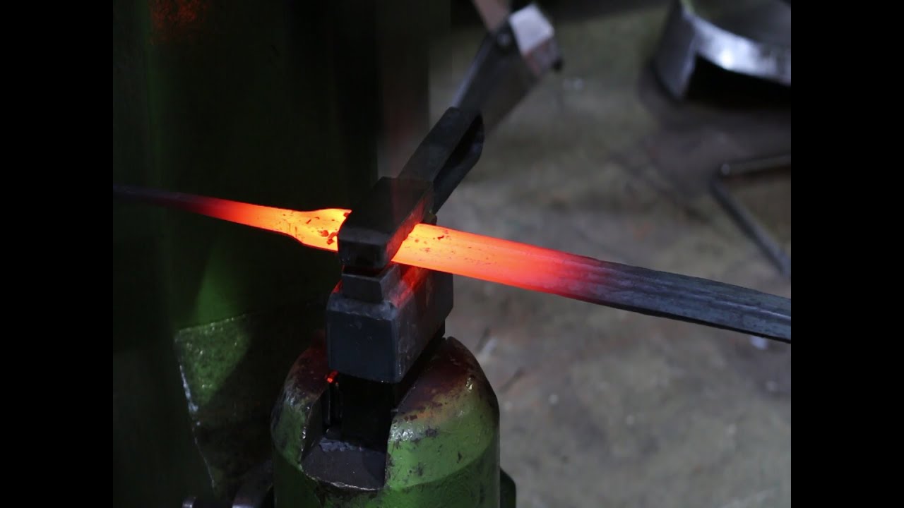Forging a damascus sword.