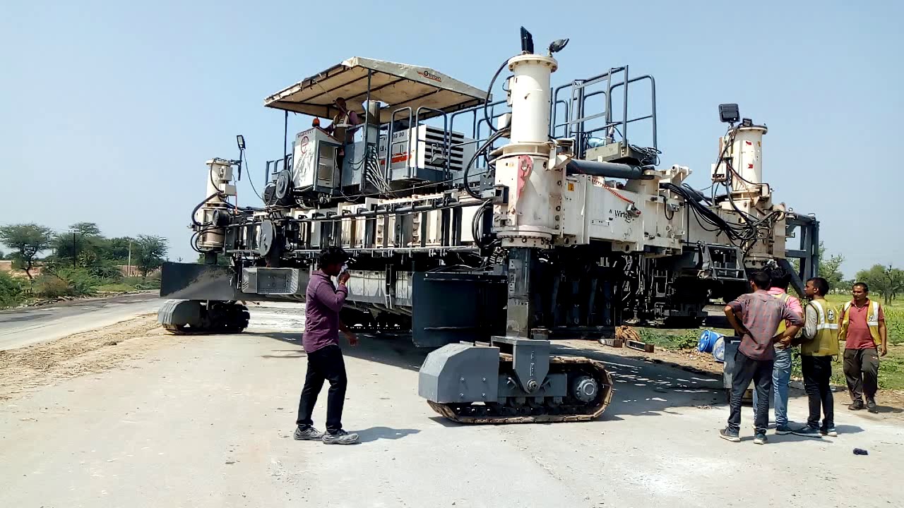 Pqc paver SP1200 rotating from paving mode to transport mode