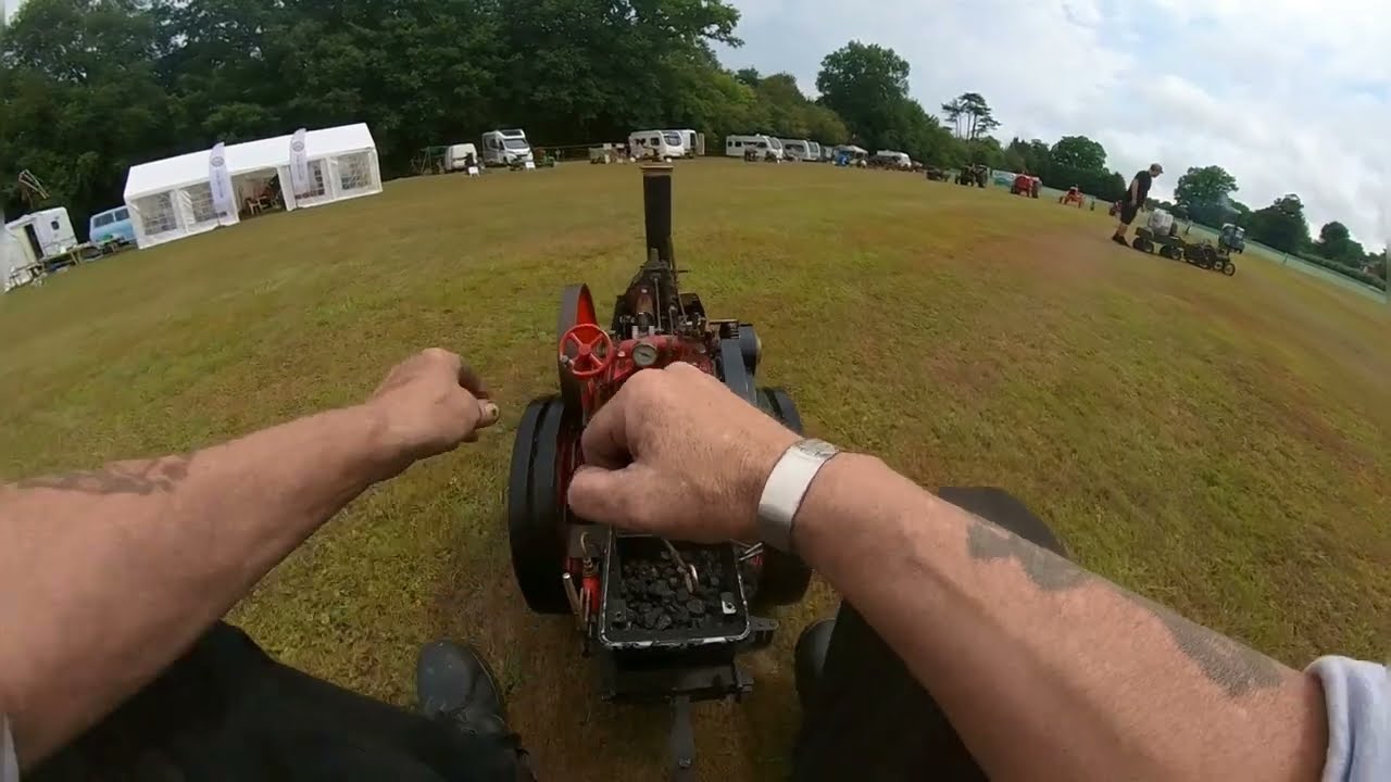 Driving a miniature traction engine.