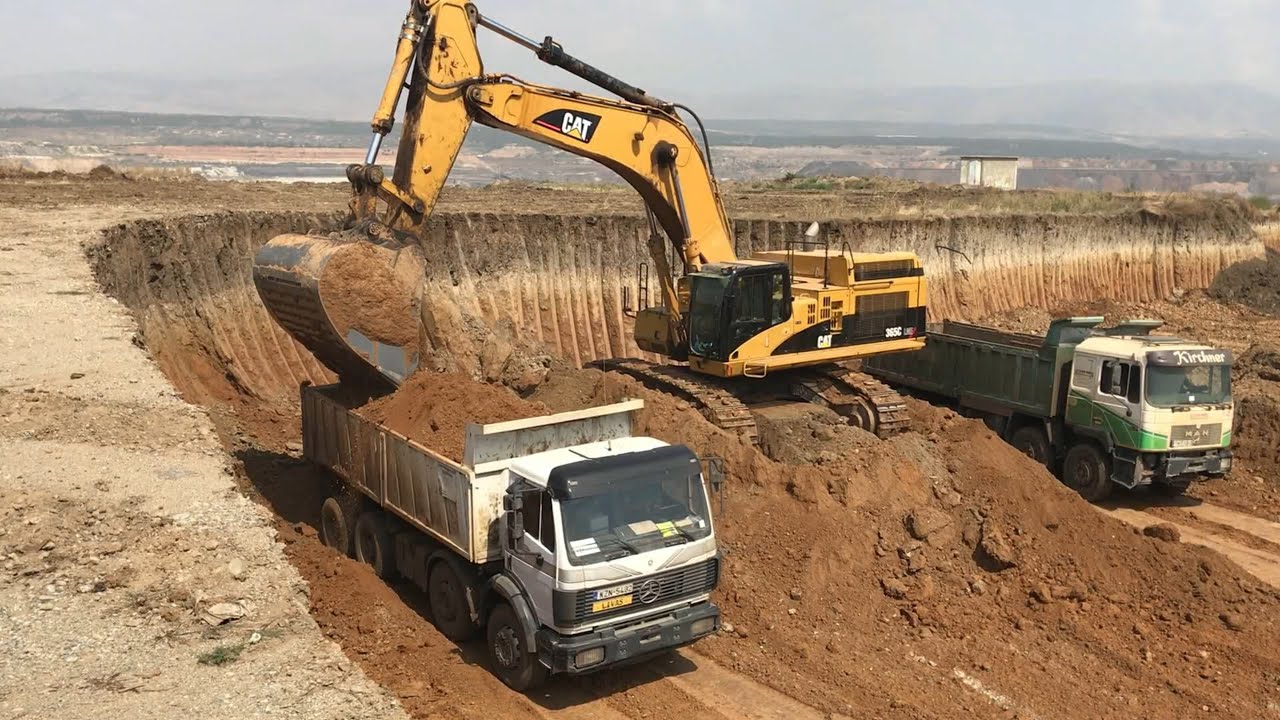 Caterpillar 365C Excavator Loading Trucks