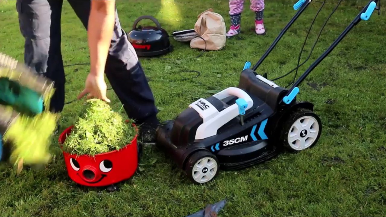 HENRY HOOVER BUCKET HELPS MAC ALLISTER MOWER TO PACK GRASSES