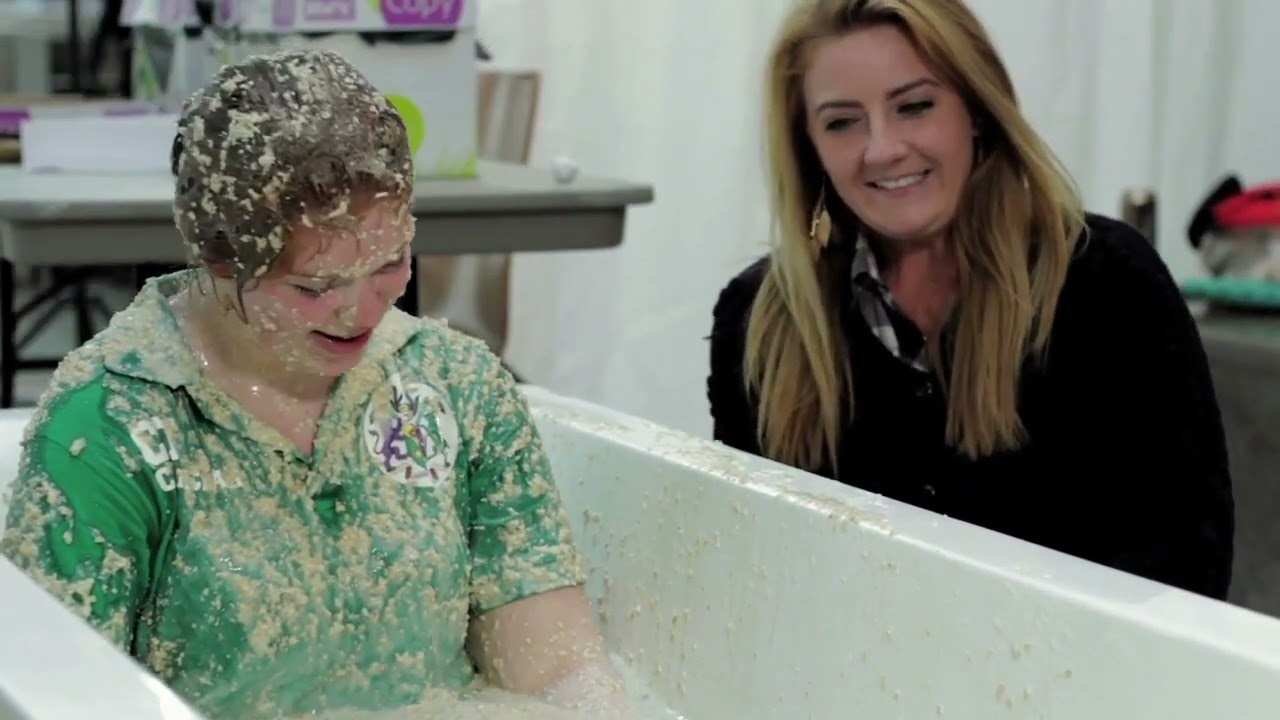 Girl gunged in a bath of porridge - better video!