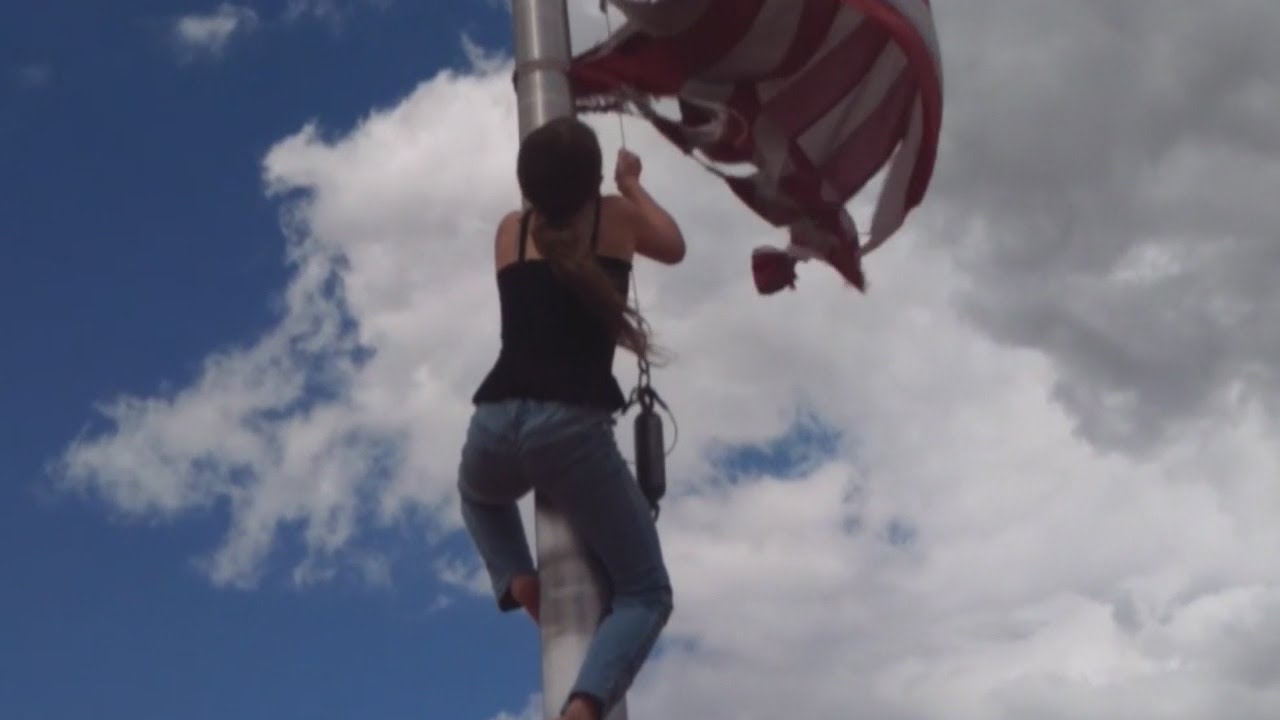 Girl climbs pole to replace ripped American flag at Bullhead Memorial Park