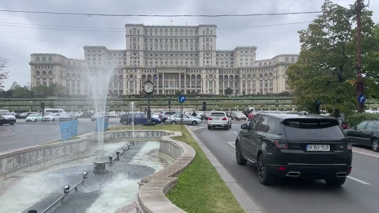 Fountains and traffic near the Palace of Parliament, Bucharest, Romania