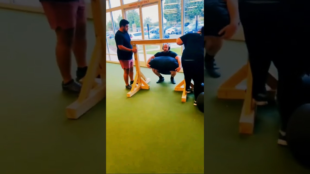 400 lb sandbag over bar #strongman #workout #gym #gymmotivation #fitness