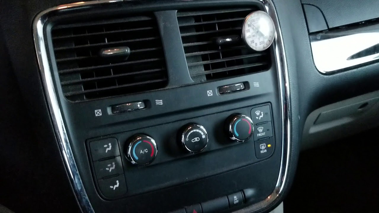 Dodge caravan flashing rear defrost button