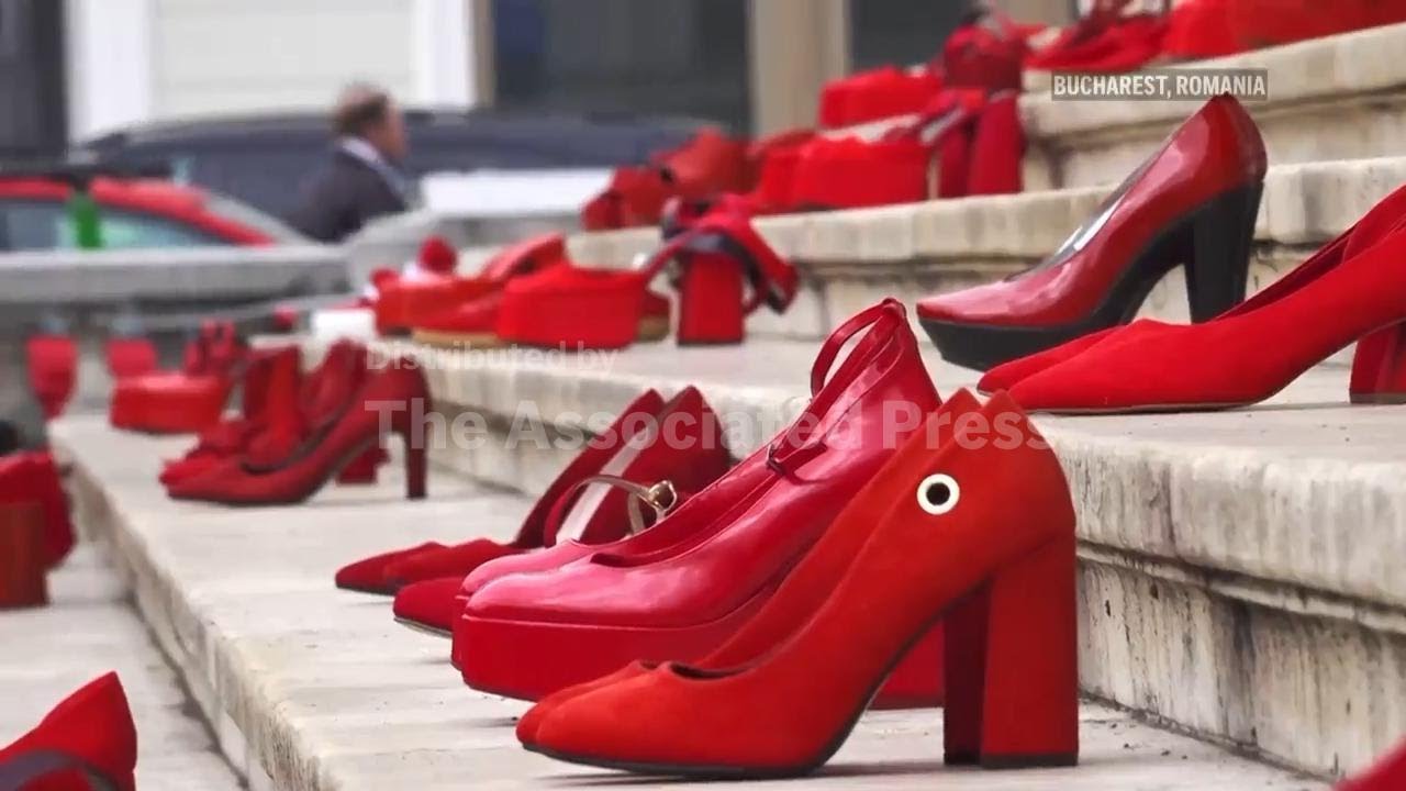 Red shoes on steps of Bucharest concert hall represent victims of domestic violence