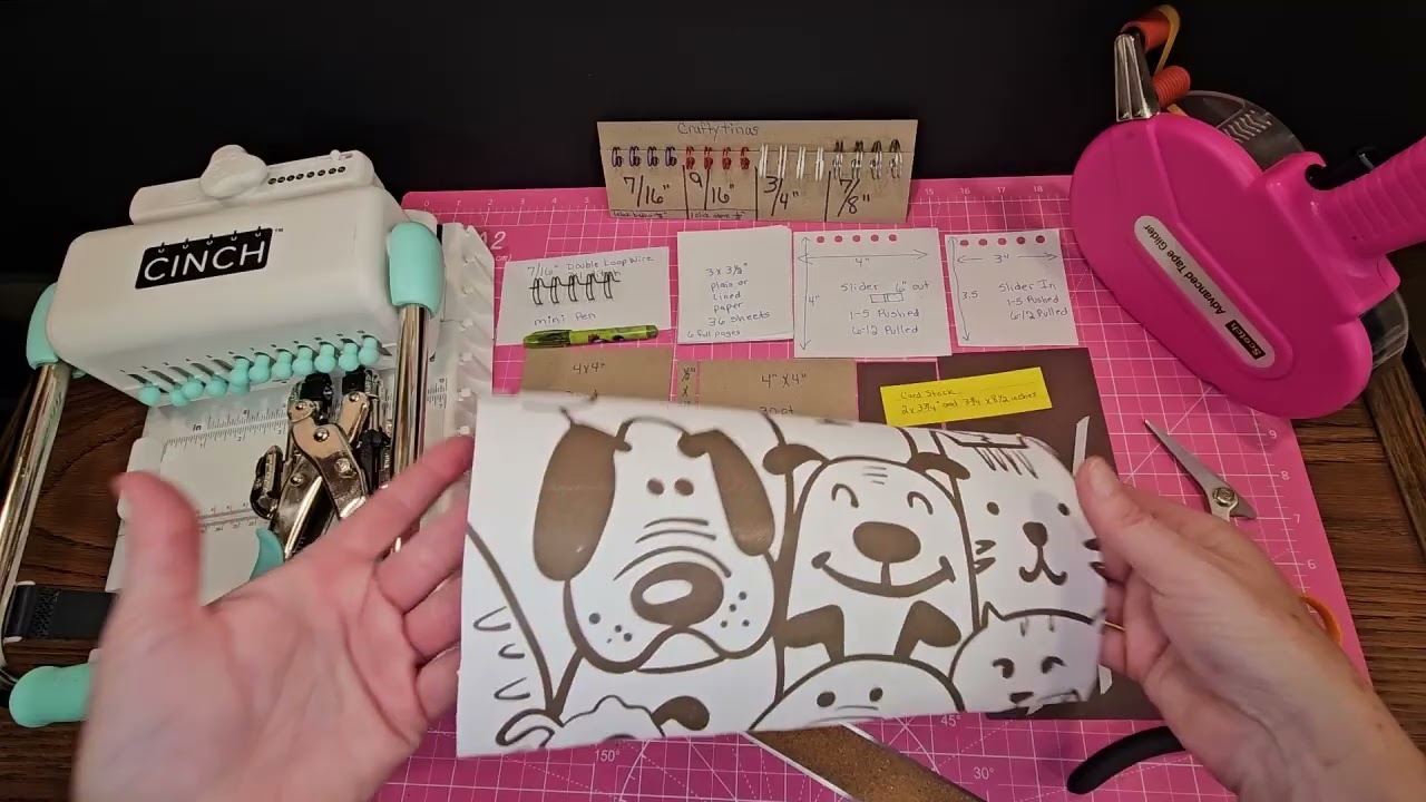 Cinch bound notebook with stickynote holder.